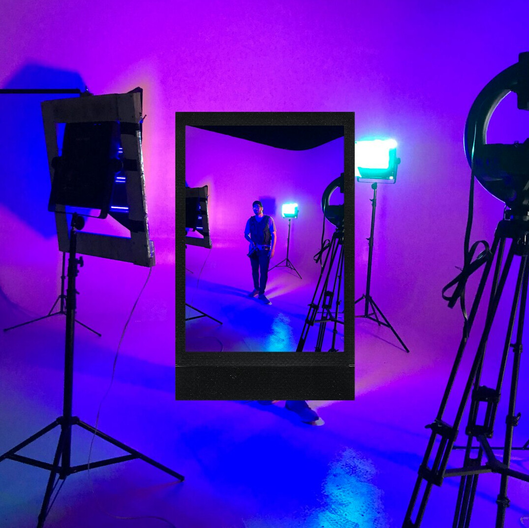 Television studio with professional cameras and bright stage lights